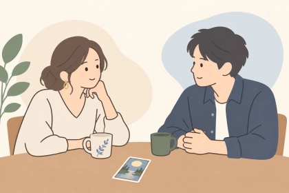 占いのカードを脇に置き、落ち着いて話し合う夫婦